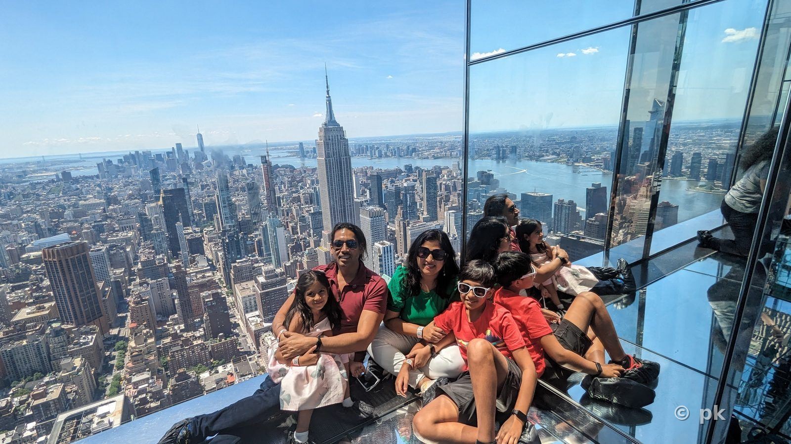 Family on an observation deck overlooking the New York City skyline